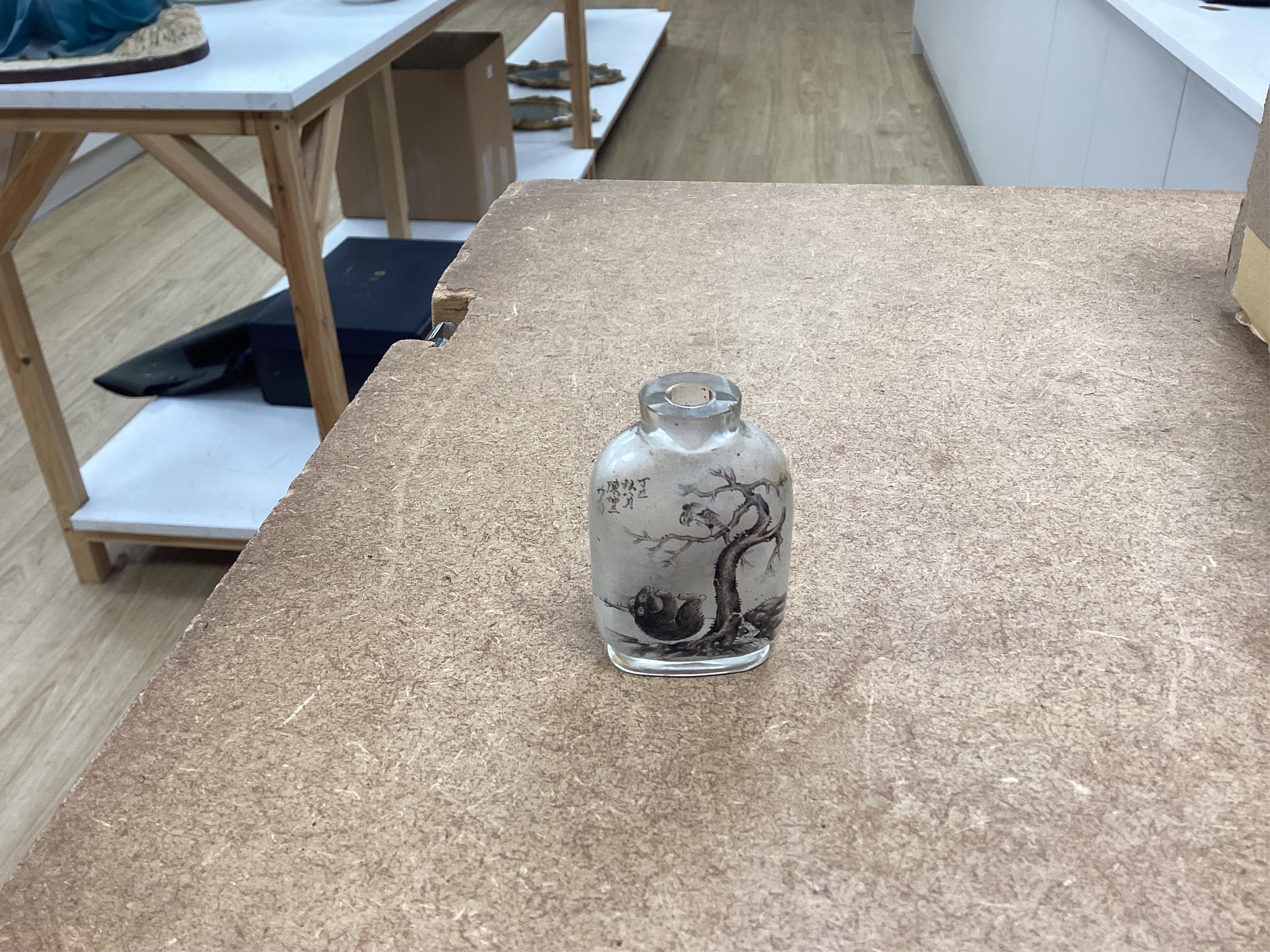 A small collection of Chinese snuff bottles, 19th century and later to include reverse glass painted examples and cinnabar lacquered examples, largest 9.5cm high